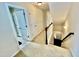 Second floor hallway with carpeted floors and access to bedrooms at 1936 Sinclair Trce, Burlington, NC 27215