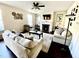 Living room with neutral colored couches, fireplace, and hardwood floors at 1936 Sinclair Trce, Burlington, NC 27215