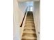 Interior view of a carpeted staircase with dark wood railing at 1936 Sinclair Trce, Burlington, NC 27215
