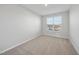Small bedroom with window and neutral walls at 21 Nettle Ln # 252, Clayton, NC 27520