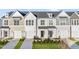 Charming townhomes featuring multiple stories, attached garages, and well-maintained landscaping at 21 Nettle Ln # 252, Clayton, NC 27520