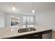 Kitchen island with granite countertop and stainless steel sink at 21 Nettle Ln # 252, Clayton, NC 27520