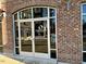 Waterstone Gathering Dentistry entrance, modern glass doors in brick building at 2225 Gathering Square Ct # 2225, Fuquay Varina, NC 27526