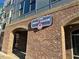 The Meat House restaurant exterior, brick building with signage at 2225 Gathering Square Ct # 2225, Fuquay Varina, NC 27526