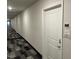 Modern hallway with neutral colored walls and carpet at 2225 Gathering Square Ct # 2225, Fuquay Varina, NC 27526