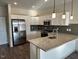 Modern kitchen with stainless steel appliances and granite countertops at 2225 Gathering Square Ct # 2225, Fuquay Varina, NC 27526