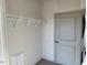 Laundry room with shelving and in-unit washer and dryer at 2225 Gathering Square Ct # 2225, Fuquay Varina, NC 27526