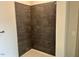 Shower with dark tile surround at 2225 Gathering Square Ct # 2225, Fuquay Varina, NC 27526