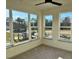 Sunroom with multiple windows and ceiling fan at 2225 Gathering Square Ct # 2225, Fuquay Varina, NC 27526