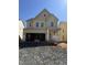 New construction two-story home featuring a covered porch and an attached two-car garage awaiting completion at 2417 Englemann Dr # 118, Apex, NC 27502