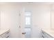 Bright bathroom with double sinks and access to a bedroom at 272 Sweetbay Tree Dr, Wendell, NC 27591