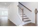 Elegant wooden staircase with white railings at 272 Sweetbay Tree Dr, Wendell, NC 27591