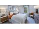 Bright bedroom with queen bed and sitting area at 274 Sweetbay Tree Dr, Wendell, NC 27591