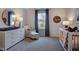 Bedroom with crib, dresser, and window at 274 Sweetbay Tree Dr, Wendell, NC 27591