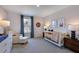 Spacious Bedroom with crib, chair, and window at 274 Sweetbay Tree Dr, Wendell, NC 27591