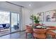 Dining area with glass table and four chairs near sliding door at 274 Sweetbay Tree Dr, Wendell, NC 27591