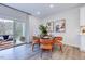 Bright dining area with glass table and four chairs, access to patio at 274 Sweetbay Tree Dr, Wendell, NC 27591