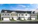 Five-unit townhome building with attached garages and landscaping at 274 Sweetbay Tree Dr, Wendell, NC 27591