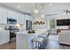 Modern kitchen with island, stainless steel appliances, and hardwood floors at 274 Sweetbay Tree Dr, Wendell, NC 27591