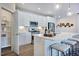 Modern kitchen with white cabinets, large island, and stainless steel appliances at 274 Sweetbay Tree Dr, Wendell, NC 27591