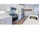 Modern kitchen with stainless steel appliances and white cabinets at 274 Sweetbay Tree Dr, Wendell, NC 27591