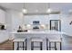 Modern kitchen with white cabinets, large island, and stainless steel appliances at 274 Sweetbay Tree Dr, Wendell, NC 27591