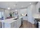 Modern kitchen with white cabinets, large island, and stainless steel appliances at 274 Sweetbay Tree Dr, Wendell, NC 27591