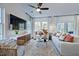 Bright living room with comfy seating, large TV, and big windows at 274 Sweetbay Tree Dr, Wendell, NC 27591