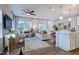 Open living room with hardwood floors, neutral decor, and access to kitchen at 274 Sweetbay Tree Dr, Wendell, NC 27591