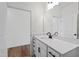 Elegant bathroom with quartz countertops, white cabinetry, and modern black fixtures, blending style with practicality at 30 Rosewood Ln, Youngsville, NC 27596