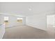 Carpeted loft area with multiple windows offering natural light at 30 Rosewood Ln, Youngsville, NC 27596