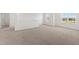 Bright, carpeted loft area with several windows at 30 Rosewood Ln, Youngsville, NC 27596