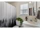 Full bathroom with shower/tub combo and window at 3018 E Cotton Gin Dr, Clayton, NC 27527