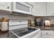 White appliances and cabinetry in this kitchen at 3018 E Cotton Gin Dr, Clayton, NC 27527