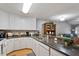 Modern kitchen featuring white cabinets and granite countertops at 3018 E Cotton Gin Dr, Clayton, NC 27527