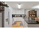 White kitchen with granite countertops and stainless steel appliances at 3018 E Cotton Gin Dr, Clayton, NC 27527