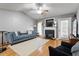 Living room with a fireplace and hardwood floors at 3018 E Cotton Gin Dr, Clayton, NC 27527