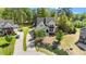 Aerial view of home with lush landscaping, long drive, and neighboring homes at 3308 Eden Grove Rd, Fuquay Varina, NC 27526