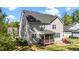 View of the house showing the backyard, screened porch and patio with outdoor furniture at 3308 Eden Grove Rd, Fuquay Varina, NC 27526
