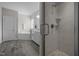 A bright bathroom featuring a tiled shower, soaking tub, and double sink vanity at 3308 Eden Grove Rd, Fuquay Varina, NC 27526