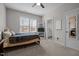 Bright bedroom with natural light, a TV on shelves, and an ensuite bathroom view at 3308 Eden Grove Rd, Fuquay Varina, NC 27526