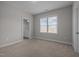 Bedroom with carpet flooring, a window letting in natural light, and an en-suite bathroom at 3308 Eden Grove Rd, Fuquay Varina, NC 27526