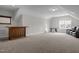 Spacious bonus room with carpet, features a bar, foosball table, and comfortable seating at 3308 Eden Grove Rd, Fuquay Varina, NC 27526
