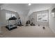 Bonus room with multiple windows and carpet flooring, equipped with exercise equipment at 3308 Eden Grove Rd, Fuquay Varina, NC 27526