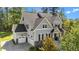 Well maintained home featuring gray siding, a two-car garage and an inviting front porch and a landscaped yard at 3308 Eden Grove Rd, Fuquay Varina, NC 27526