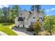 Well maintained home featuring gray siding, a two-car garage and a inviting front porch and a landscaped yard at 3308 Eden Grove Rd, Fuquay Varina, NC 27526