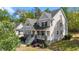 Charming two-story home featuring classic architecture, an inviting front porch and professionally landscaped yard at 3308 Eden Grove Rd, Fuquay Varina, NC 27526