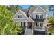 Charming two-story home boasts gray siding, stone accents, and a welcoming front porch at 3308 Eden Grove Rd, Fuquay Varina, NC 27526