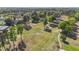Panoramic aerial view of a well-maintained golf course surrounded by mature trees at 3308 Eden Grove Rd, Fuquay Varina, NC 27526
