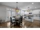Sun-filled kitchen features a breakfast nook and access to the deck at 3308 Eden Grove Rd, Fuquay Varina, NC 27526